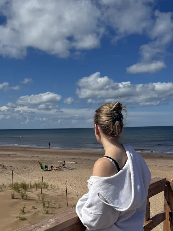 Abby, Burlington-based student therapist, in a relaxed outdoor environment