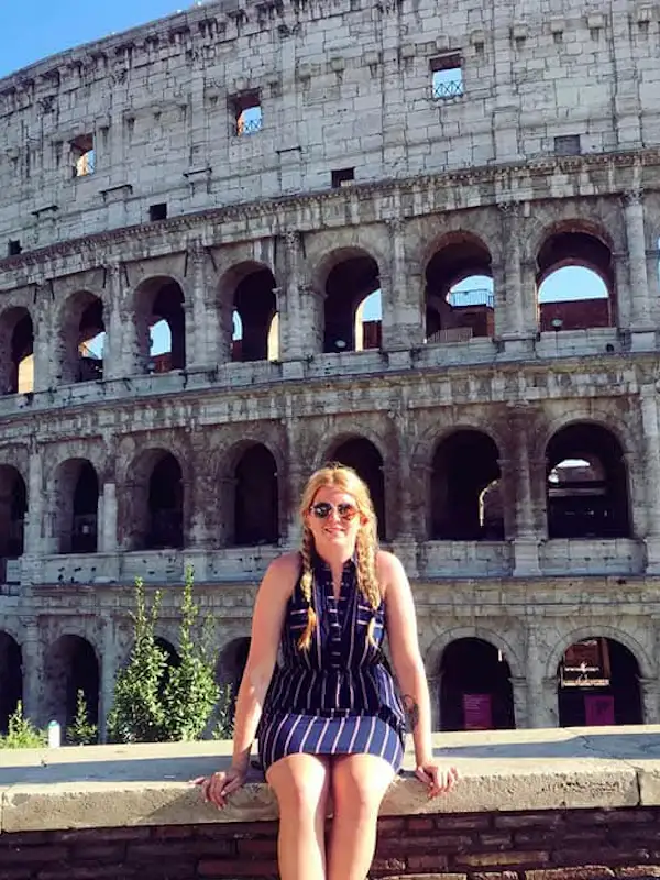 girl in front of the Colloseum