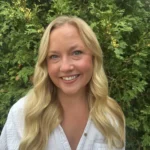 Headshot of Jackie Bowie, Registered Psychotherapist (Qualifying), smiling warmly in a professional setting.