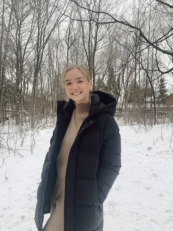 Abby exploring nature during her travels, bringing a grounded and reflective perspective to her work