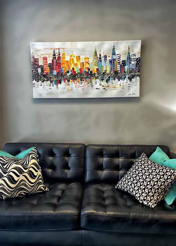 Leather sofa with artwork on wall above