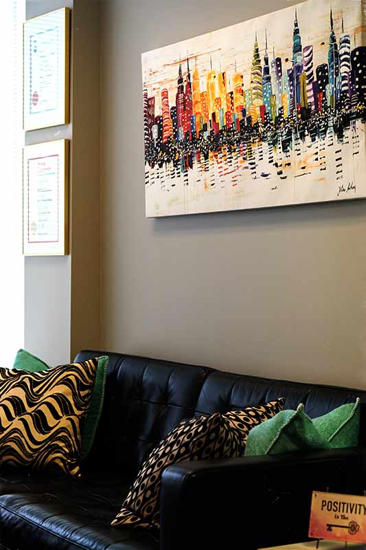 Sofa with artwork above on wall