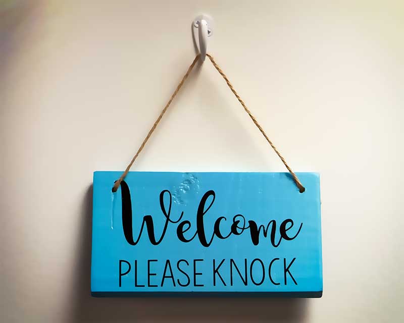 Sign for door saying please knock