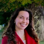 A woman w with dark hair in in a red coat
