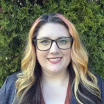 Woman with glasses and blonde hair