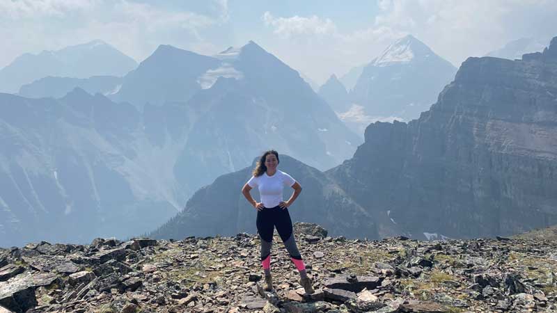 Woman at top of mountain in Canada