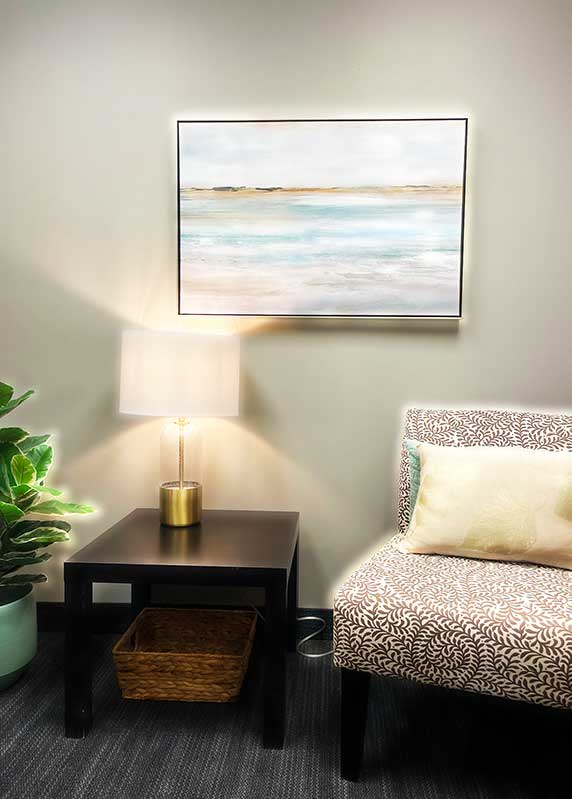 Lamp on a table by a sofa