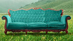 Green couch in the countryside